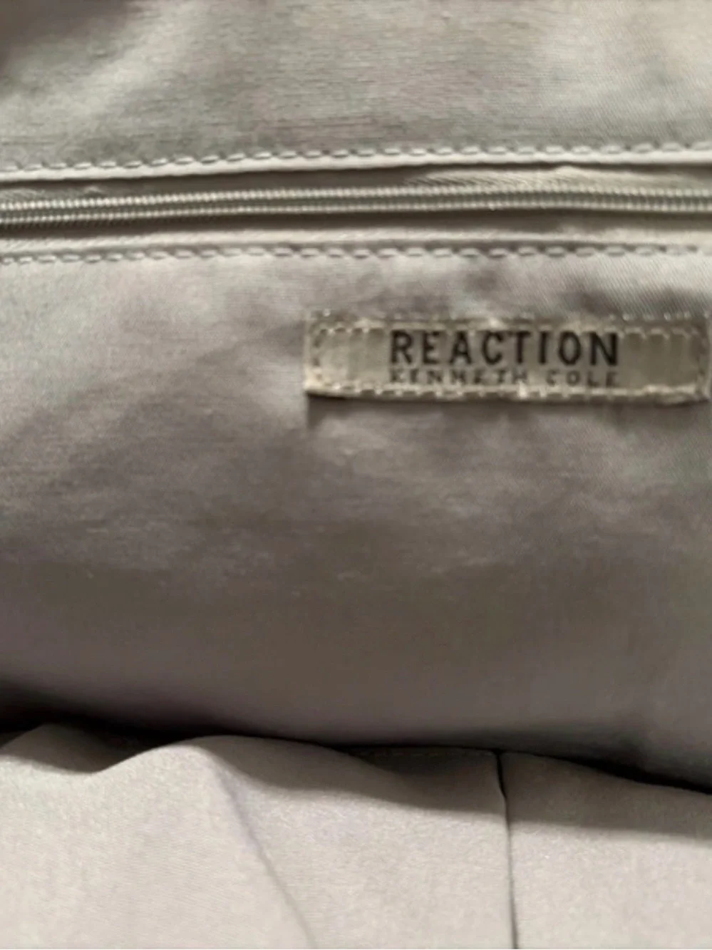 Kenneth Cole Reaction Satchel with white red and yellow floral accent.